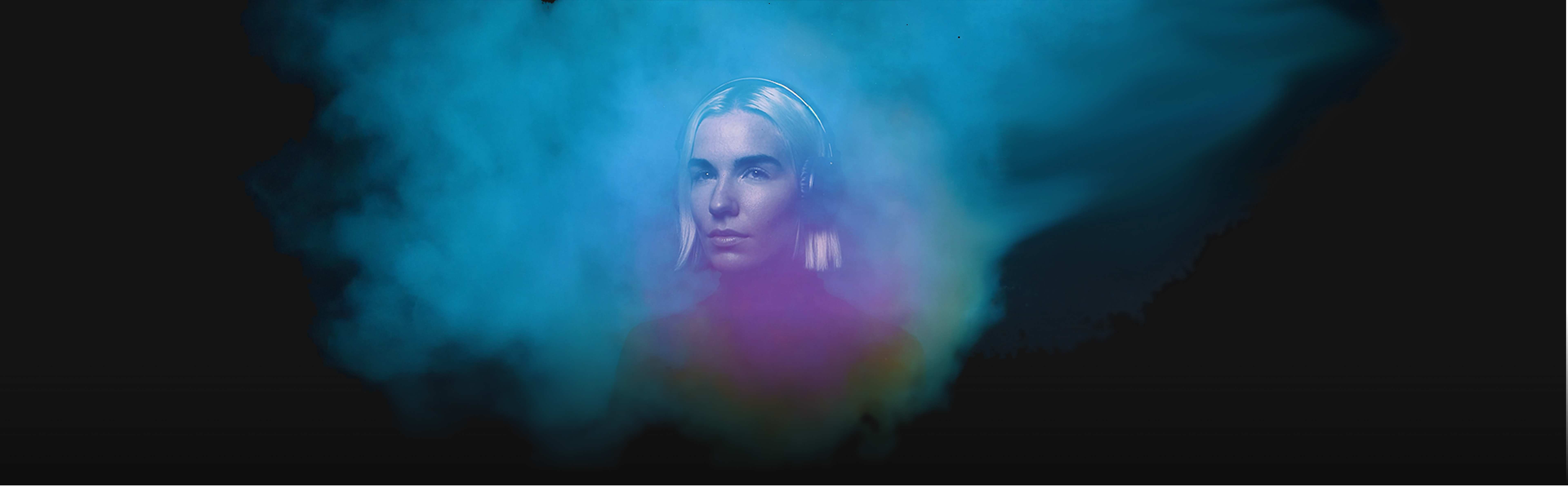 Woman with headphones in atmospheric blue light